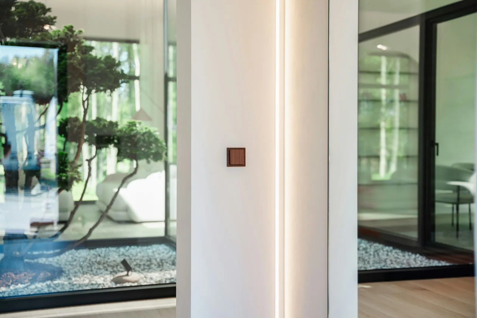 Light-filled room with neutral walls and natural furnishings